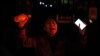 Una mujer grita durante una protesta en Beijing el domingo 27 de noviembre de 2022. (AP Foto/Ng Han Guan)