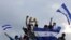 Manifestantes antigubernamentales realizan una protesta para que el presidente nicaragüense Daniel Ortega y su esposa, la vicepresidenta Rosario Murillo, abandonen el poder. (Inti Ocon / AFP).